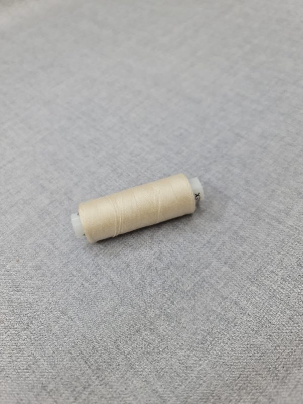 Thread in cream white colour 306